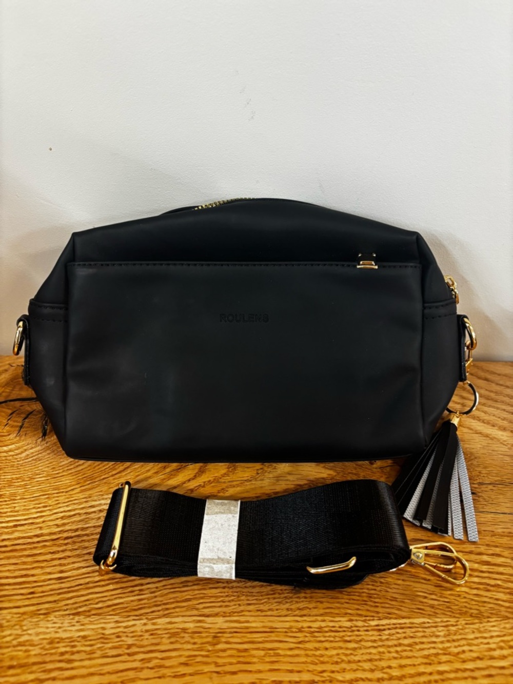 Roulens Black Crossbody Bag with Tassel and Wide Strap